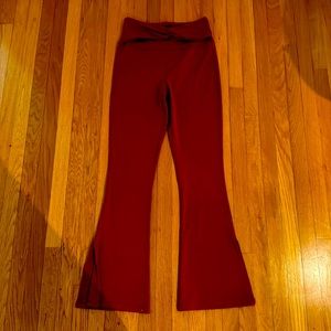 Thrive Societe twist flare leggings size medium, color burgundy. New with tags.